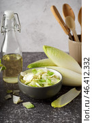 Bowl of cut fresh endive on table. Стоковое фото, фотограф Pixel_shot / Фотобанк Лори