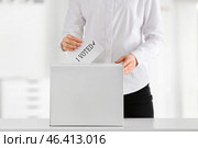 Voting woman near ballot box indoors. Стоковое фото, фотограф Pixel_shot / Фотобанк Лори