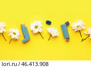 Asthma inhalers with daisy flowers on yellow background. Стоковое фото, фотограф Pixel_shot / Фотобанк Лори
