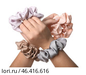 Female hands with scrunchies on white background. Стоковое фото, фотограф Pixel_shot / Фотобанк Лори
