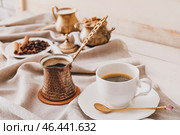 Турка, чашка кофе, сахар и молоко на столе. Стоковое фото, фотограф Pixel_shot / Фотобанк Лори
