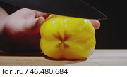 In the process of culinary preparation, we are slicing a fresh and vibrant yellow bell pepper. Стоковое видео, видеограф Владимир Ковальчук / Фотобанк Лори
