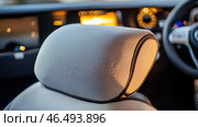 Comfortable perforated leather headrest in modern premium car interior. Стоковое AI-изображение, AI-художник Юрий Поздников / Фотобанк Лори