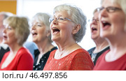 Senior choir singing with passion and enthusiasm. Стоковое AI-изображение, AI-художник Юрий Поздников / Фотобанк Лори