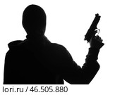 Силуэт бандита с ружьем на белом фоне. Стоковое фото, фотограф Pixel_shot / Фотобанк Лори