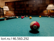 American billiards. The balls are on the green billiard table. We spend time at home playing our favorite sports game. Стоковое фото, фотограф Photojuli / Фотобанк Лори