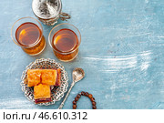 Top view of big metal tray with turkish baklava on planked wooden table. Стоковое фото, фотограф Сергей Толмачёв / Фотобанк Лори