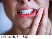 Young woman suffering from herpes on lips, health problems concept. Стоковое AI-изображение, AI-художник Станислав Тарко / Фотобанк Лори