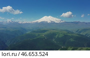 Mount Elbrus and hills Caucasus mountains. Стоковое видео, видеограф Михаил Коханчиков / Фотобанк Лори
