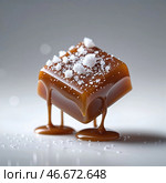 Delicious caramel dessert with a glossy finish and a sprinkle of sea salt on a reflective surface. Стоковое AI-изображение, AI-художник Сергей Толмачёв / Фотобанк Лори