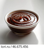 Rich chocolate sauce presented in a small white bowl on a clean surface. Стоковое AI-изображение, AI-художник Сергей Толмачёв / Фотобанк Лори