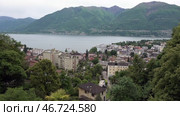 Озеро Маджоре и город Локарно в пасмурный день. Швейцария. Май. Lake Maggiore and the city of Locarno on a cloudy day. Switzerland. May. Стоковое видео, видеограф Горшков Александр / Фотобанк Лори