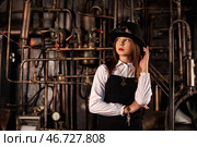 Intriguing Teenage Girl Model Explores a Unique Indoor Environment With Vintage Machinery. Стоковое фото, фотограф Aleksandr Golubev / Фотобанк Лори