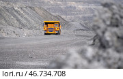 Heavy large transport in mining industry on background of open white multistage quarry. Стоковое фото, фотограф David Kashakhi / Фотобанк Лори