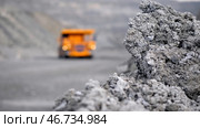 Heavy large transport in mining industry on background of open white multistage quarry. Стоковое фото, фотограф David Kashakhi / Фотобанк Лори
