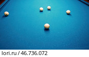 Close-up of someone aiming the billiard ball with cue. Стоковое фото, фотограф David Kashakhi / Фотобанк Лори