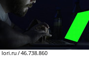 The young handsome man learn in his computer at night. Стоковое фото, фотограф David Kashakhi / Фотобанк Лори