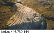Top view of picturesque quarry located on coastal mountain near village in forest. Стоковое фото, фотограф David Kashakhi / Фотобанк Лори