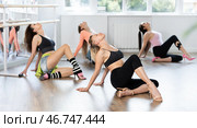Female dancer mastering floorwork during high heels dance routine. Стоковое фото, фотограф Яков Филимонов / Фотобанк Лори