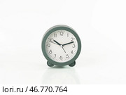 Gray traditional alarm clock round shape on white background. Isolated. Стоковое фото, фотограф Хорошилова Светлана / Фотобанк Лори