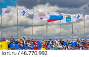 Russia, Samara. 30. 08. 2015. Russian flags RPL Russia Krylia Sovetov against the blue sky. Text in Russian: Russian Football Union. Редакционное фото, фотограф Акиньшин Владимир / Фотобанк Лори