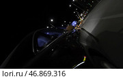 Fast black car driving at night road through the city, view from wheel, timelapse. Стоковое фото, фотограф David Kashakhi / Фотобанк Лори