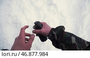 Soldier throws a hand grenade into a battle tank or armored personnel carrier, winter backround, Soldier throws a training grenade into a tank in the winter forest. Стоковая иллюстрация, иллюстратор David Kashakhi / Фотобанк Лори