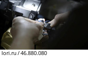 Close up for man hands repair electrics in the car by taping broken wires together. Стоковое фото, фотограф David Kashakhi / Фотобанк Лори
