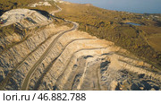 Top view of picturesque quarry located on coastal mountain near village in forest. Стоковое фото, фотограф David Kashakhi / Фотобанк Лори