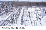 Top view of small electrical substation with rows of transformers in suburbs. Стоковое фото, фотограф David Kashakhi / Фотобанк Лори