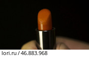 Discovery of red lipstick in the hands of men. Стоковое фото, фотограф David Kashakhi / Фотобанк Лори