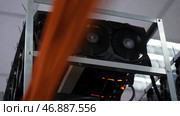 Electronic computer devices with fans and graphics processors with video cards for mining farms and cryptocurrencies. Стоковое фото, фотограф David Kashakhi / Фотобанк Лори