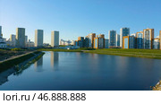 Aerial view of a beautiful city district with colorful high rise buildings on blue sky background. Стоковое фото, фотограф David Kashakhi / Фотобанк Лори