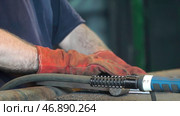 Hand Ironworker forging hot iron in workshop whith hammer. Стоковое фото, фотограф David Kashakhi / Фотобанк Лори