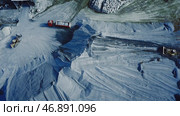 Aerial view of big career with excavators and trucks at work, heavy industry and extraction of minerals concept. Стоковое фото, фотограф David Kashakhi / Фотобанк Лори