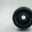 Front view of a classic 58mm camera lens with aperture blades visible, surrounded by a smooth metallic rim. Precise, sharp photography technology, essential for manual shooting enthusiasts. Стоковое фото, фотограф Андрей Ка / Фотобанк Лори