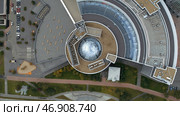 Concept of architecture, round shaped beautiful building and green lawn. Стоковое фото, фотограф David Kashakhi / Фотобанк Лори