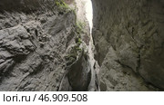 Geological formation with a very narrow passage. Стоковое фото, фотограф David Kashakhi / Фотобанк Лори