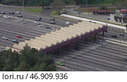 Aerial view on toll collection point on motorway. Стоковое видео, видеограф Михаил Коханчиков / Фотобанк Лори