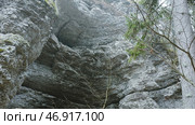 Top view of stone wall with cave in forest. Стоковое фото, фотограф David Kashakhi / Фотобанк Лори