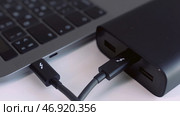 Black hard disc for backup files and important information using USB 3.0 connection. Стоковое фото, фотограф David Kashakhi / Фотобанк Лори