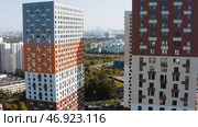 Beautiful panorama of city opens from upper floors of modern residential complex. Стоковое фото, фотограф David Kashakhi / Фотобанк Лори