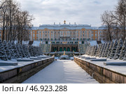 The Grand Peterhof Palace, the Grand Cascade Fountain and the Samsonovsky (Marine) Canal in the Lower Park of Peterhof on a sunny winter day, St. Petersburg, Russia. Стоковое фото, фотограф Ula Ulachka / Фотобанк Лори