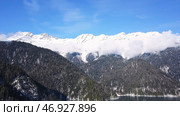 Panoramic view of beautiful white winter wonderland scenery with snowy mountain summits. Стоковое фото, фотограф David Kashakhi / Фотобанк Лори
