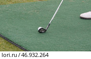 Golfer Hitting Golf Shot with Club on the Course. Стоковое фото, фотограф David Kashakhi / Фотобанк Лори