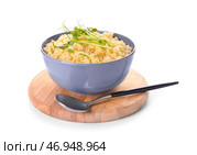 Чаша с вкусным кус-кусом и ростками на белом фоне. Стоковое фото, фотограф Pixel_shot / Фотобанк Лори
