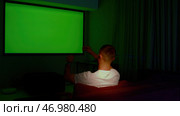 Man switching channels with hand gestures, gesture interface, modern technology. Стоковое фото, фотограф David Kashakhi / Фотобанк Лори