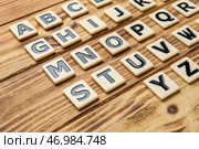 Различные буквы на деревянном фоне, крупным планом. Концепция алфавита. Стоковое фото, фотограф Pixel_shot / Фотобанк Лори