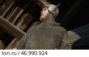 Close up of a warrior in chainmail armor whistling with his fingers. Стоковое фото, фотограф David Kashakhi / Фотобанк Лори
