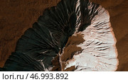 Aerial of wide gorge with rocky cliffs from both sides of small canyon. Стоковое фото, фотограф David Kashakhi / Фотобанк Лори